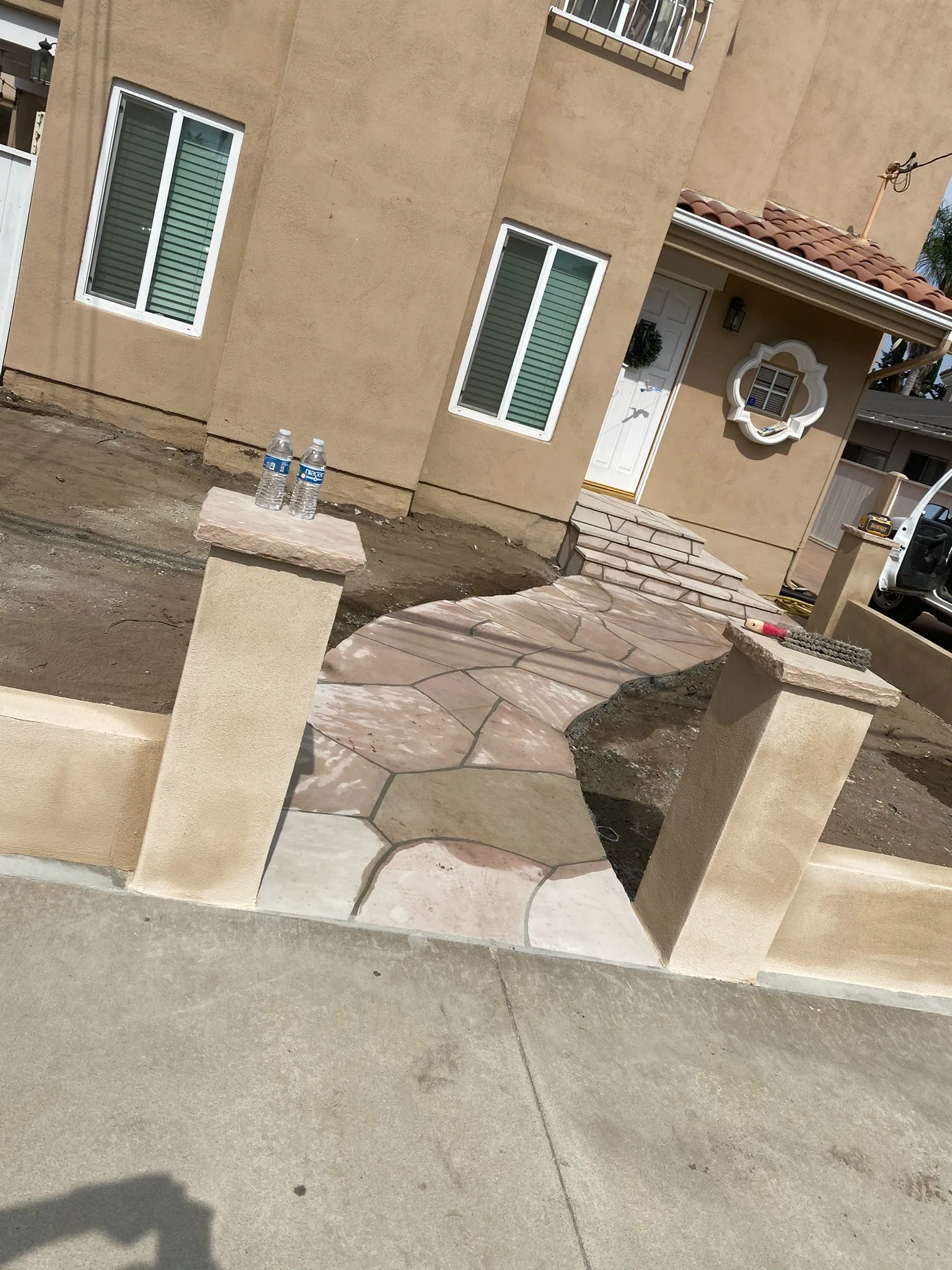 Stone-clad entry steps leading to a front door