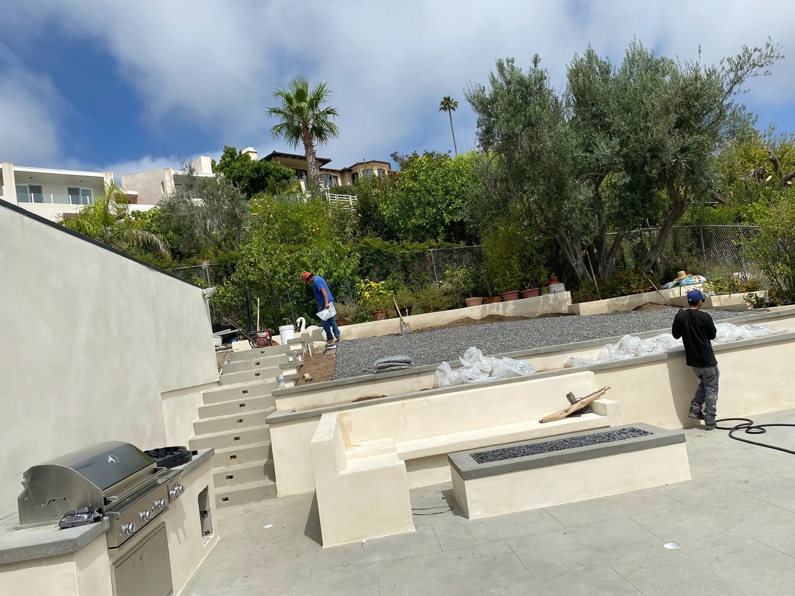 Stucco fire pit and BBQ area on a hillside overlook